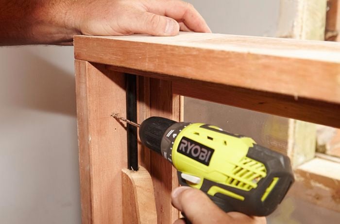 Drilling pilot holes for the sash window frame