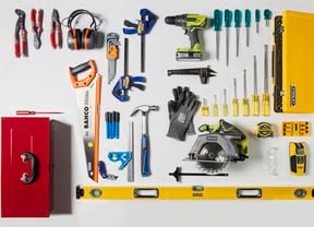 Tools laid out on benchtop, including a Bahco saw, earmuffs and Stanley screwdrivers.