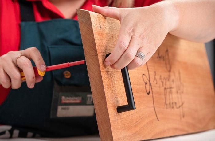 Attaching handles to the serving board.