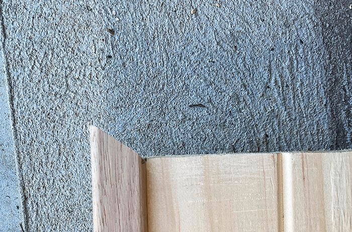 Corner moulding used to frame a pine panel