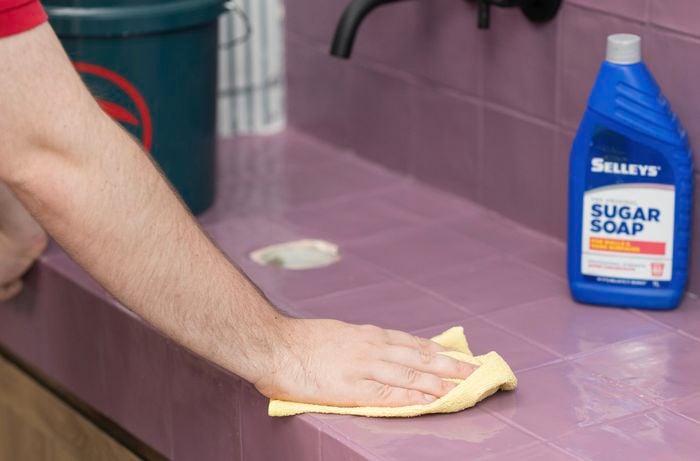 Clean the tiles with a cloth using sugar soap solution