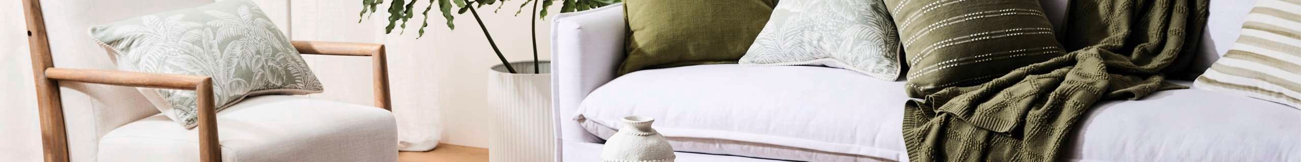 Madras image with couch and throw rug with pillows decorating placed