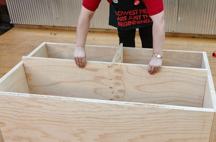 Inner shelves for a laundry basket dresser being positioned inside the frame