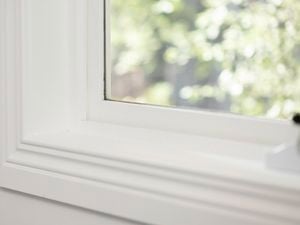 A picture depicting a window with architraves framing its edges.