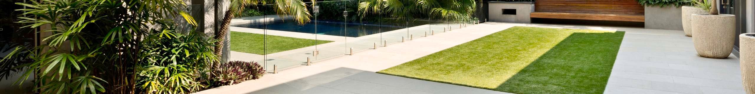 Tuff turf header image with pool and outdoor setting in frame