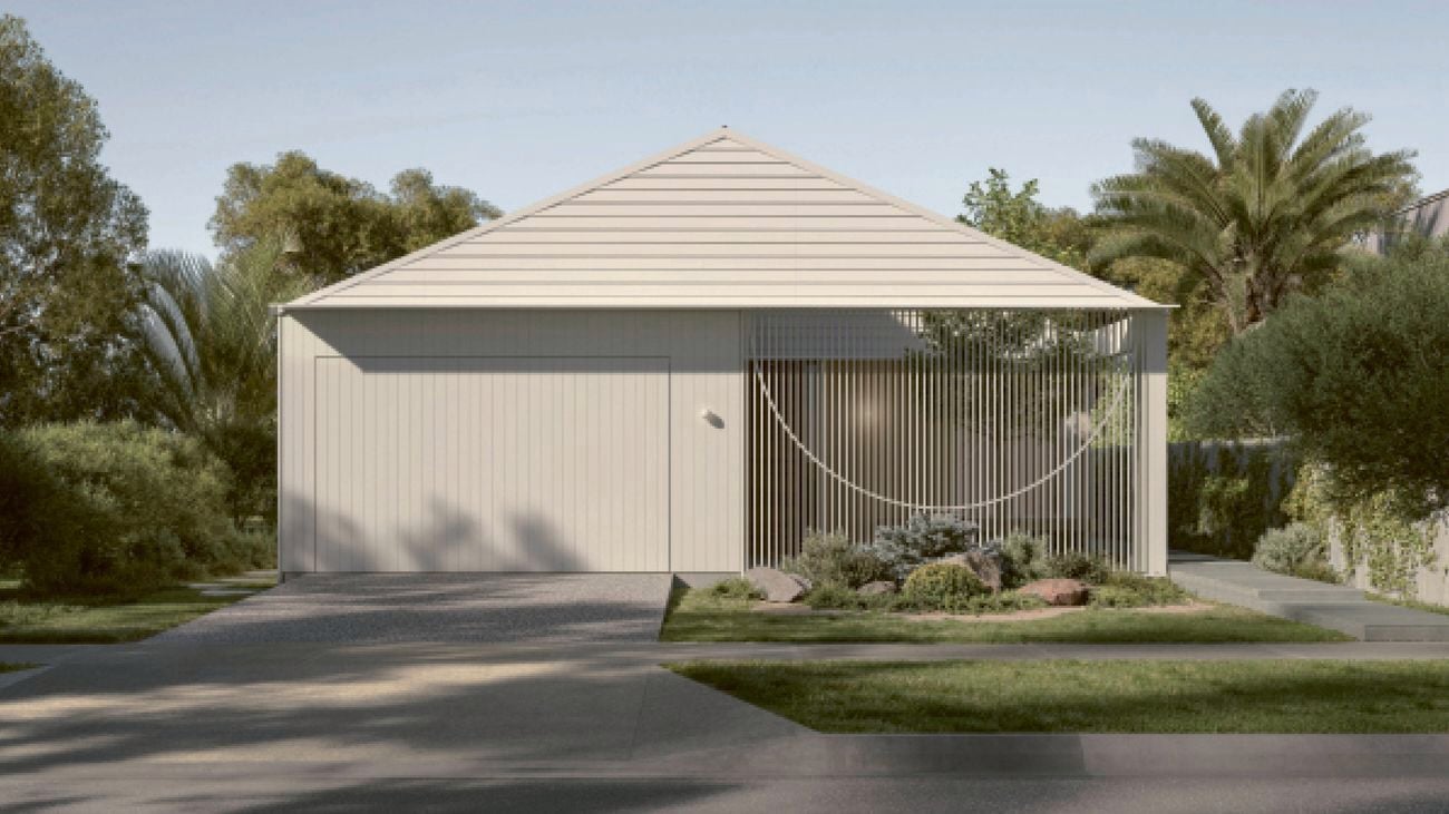Modern garage with pitched roof, slatted screen and landscaping, set amongst greenery.