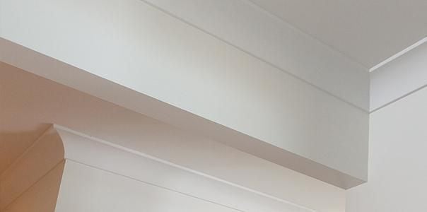 Close up of white walls, ceiling and cornice