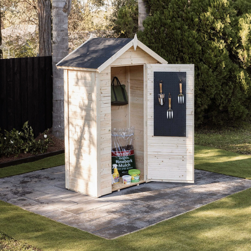 Small timber garden shed with a pitched roof and open door featuring a pegboard for hand tools, containing gardening supplies and mulch.