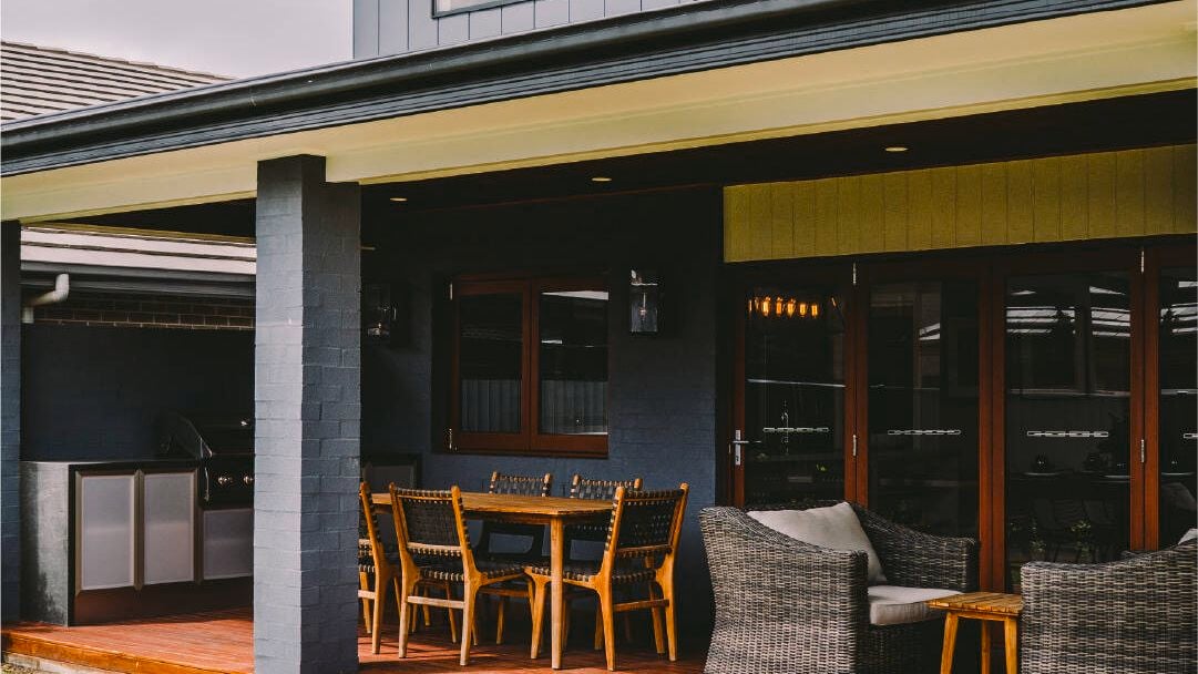 Outdoor entertaining area with timber deck and furniture