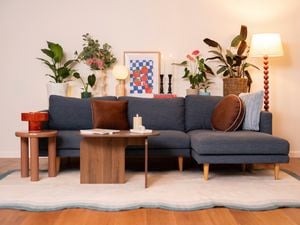 The shelf is styled with a mix of practical and decorative items to make the space feel warm and organised. 