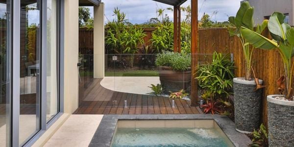Back yard with a pool and wooden decking