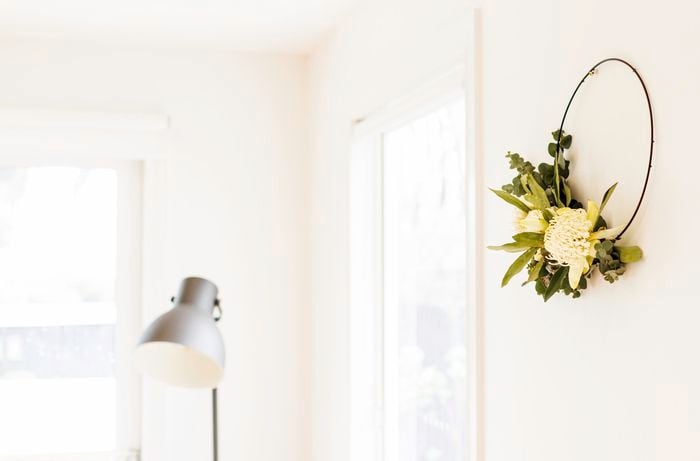 ring of dried flowers hanging on a wall