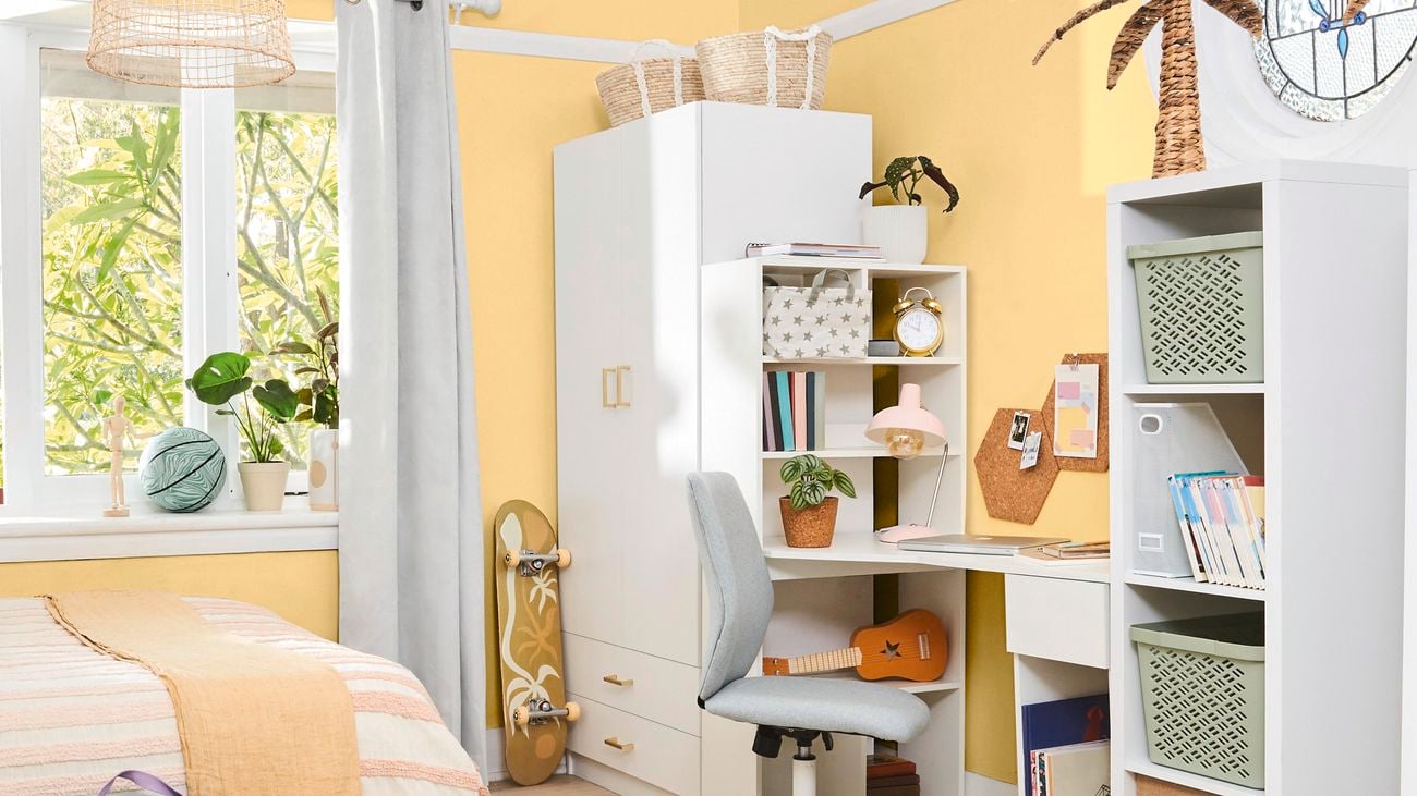 A teenager bedroom featuring yellow walls painted in Good To Go by British Paints