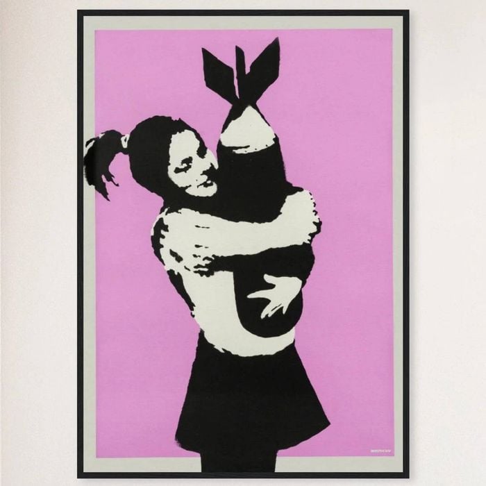 Galrie Banksy Bomb Hugger Art Print Iconic Street Art from 2003, Black Frame, 50 x 70cm (20 x 28inch)
