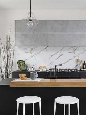 Modern kitchen with kitchen island and white stools