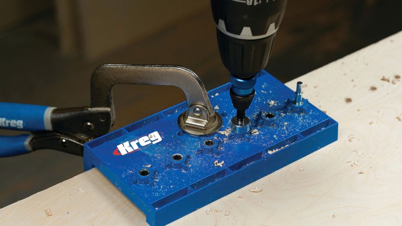 A Kreg shelf pin jig being used in a timber project