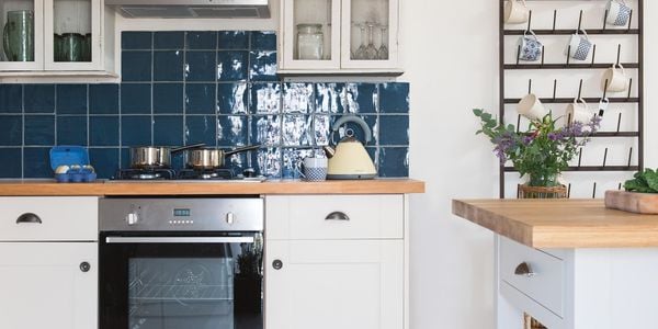 Kitchen with oven and light brown timber flooring