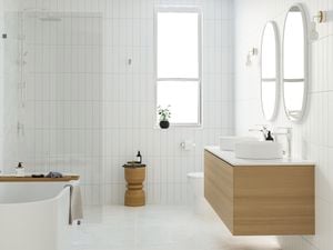 modern bathroom with white tiles, freestanding bath, timber vanity and double mirrors