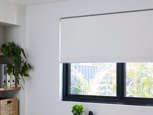 White Riva blinds in a home office interior.