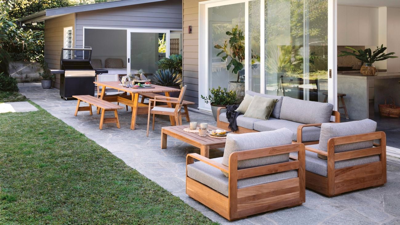 Backyard with an outdoor setting and an outdoor table and chairs