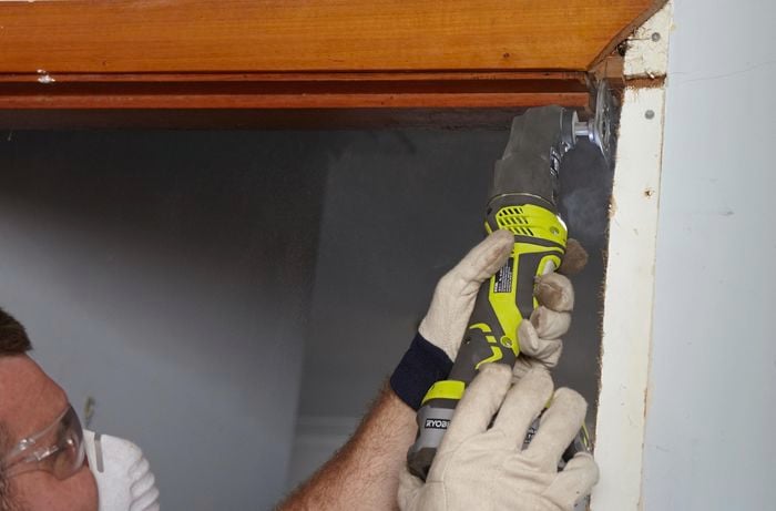 A notch being cut out of a wall to make room for a new door jamb