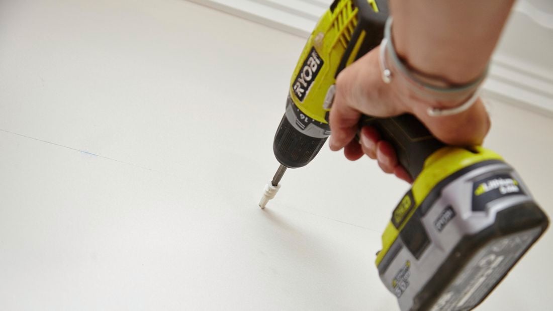 Wall plugs being drilled into a wall to cater for wall mounted brackets
