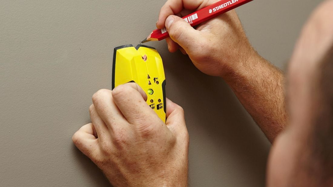 DIY Step Image - How to install a towel rail into plaster . Blob storage upload.
