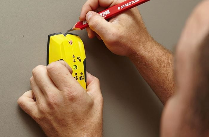 DIY Step Image - How to install a towel rail into plaster . Blob storage upload.