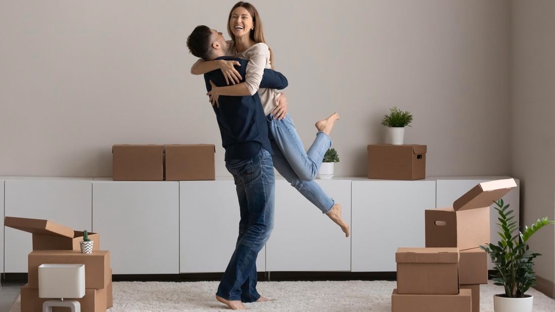 couple hugging in a new house
