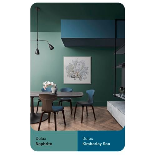 Dulux artboard with a flower wall print, chairs and table with vase.