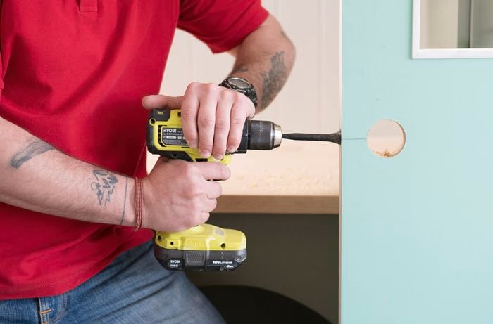 Drill a hole in the door edge 