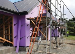 House under construction with GIB Weatherline cladding and scaffolding