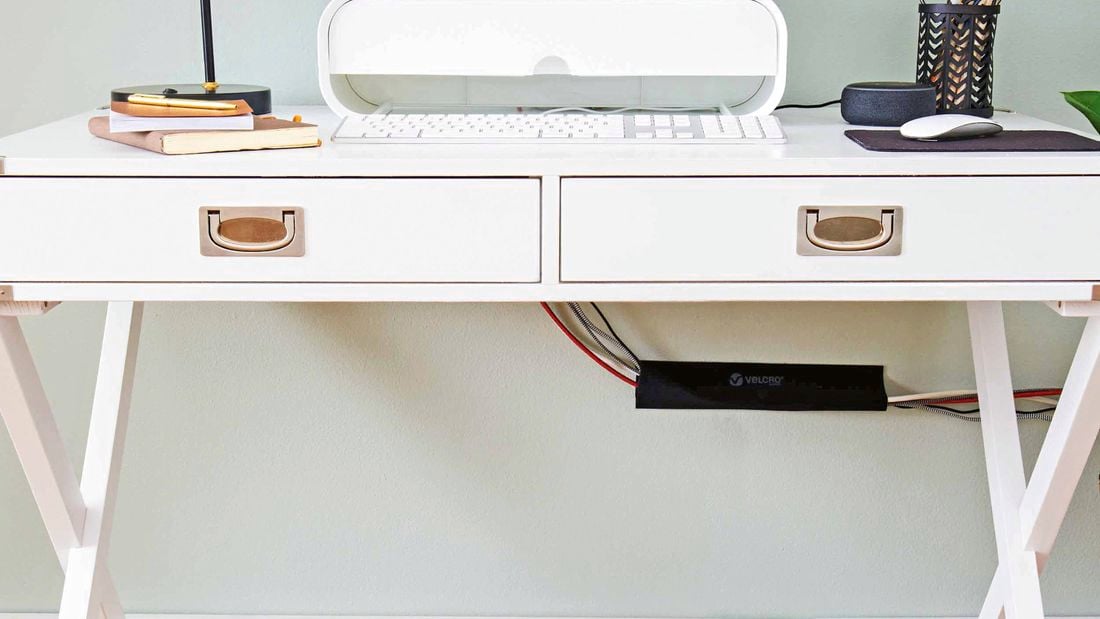 Velcro cable sleeve underneath workstation.