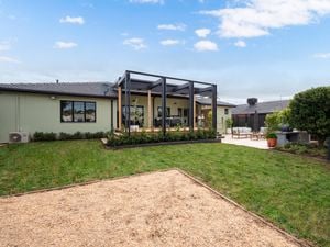The back of a house with an entertaining area int it