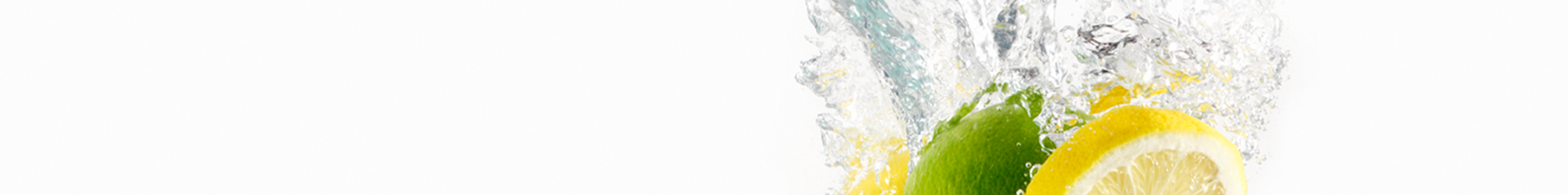 Lemons and lime splashing in clear water.