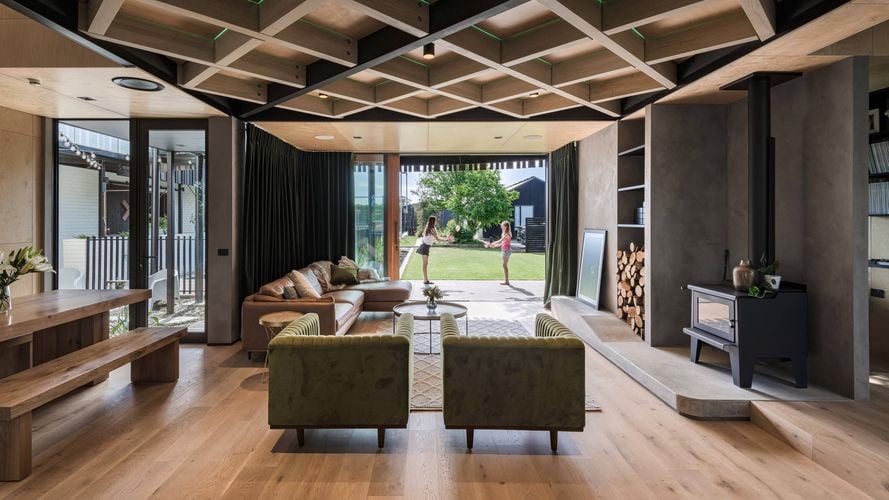Living area with exposed floor joists above