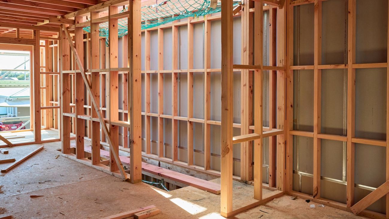 A clean and tidy construction site at framing stage.
