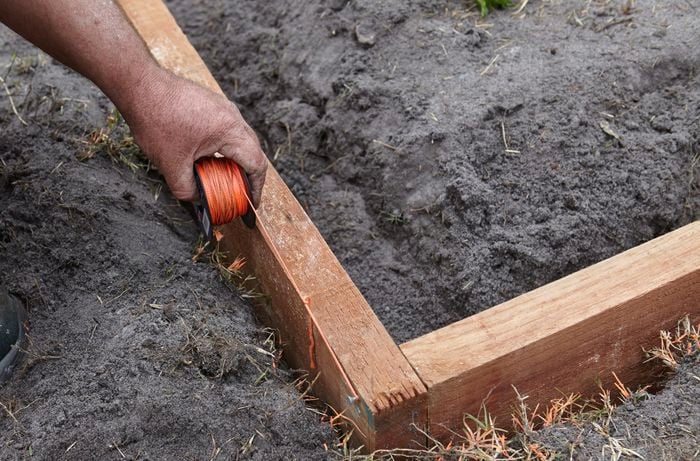 String being used to plot out a garden bed