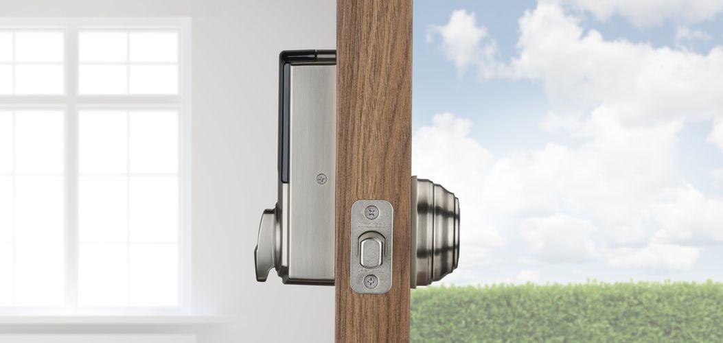 Side view of front door showing exterior and interior of front door lock