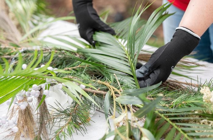 assembling foliage to make a christmas chandelier