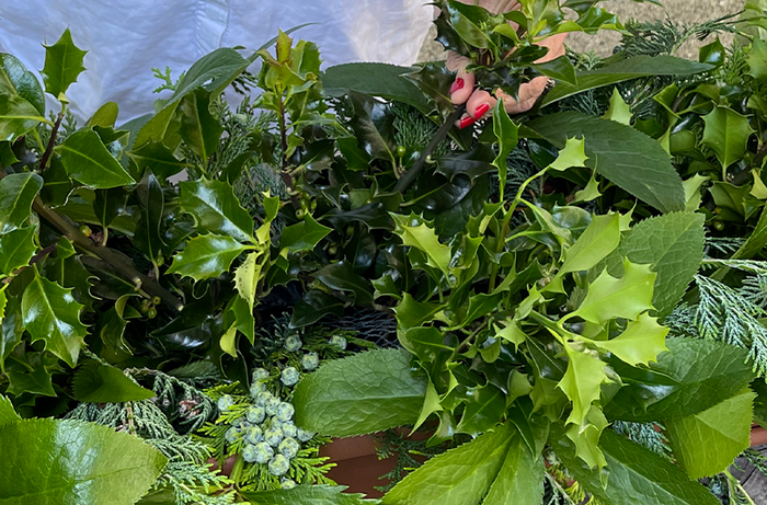 Adding foliage into planter box arrangment