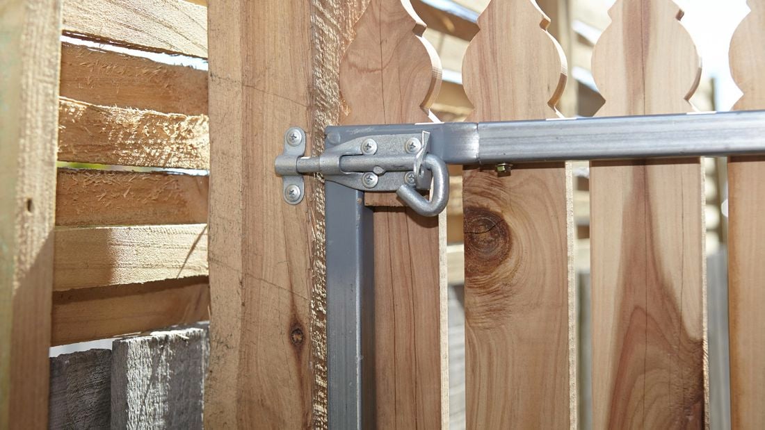 The back of a picket gate showing the pad bolt secured