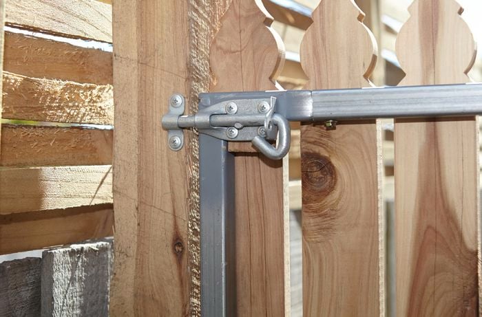 The back of a picket gate showing the pad bolt secured
