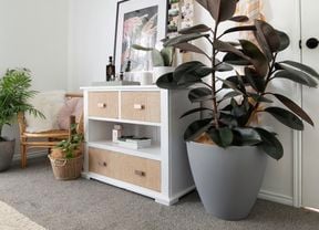 White chest of drawers with hessian covering on drawer fronts