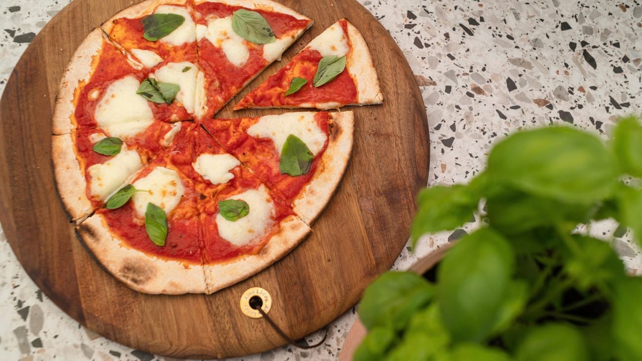 Close up view of a freshly baked pizza with melted cheese.