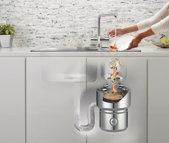 Kitchen sink with InSinkErator installed with rendering of InSinkErator blending food scraps