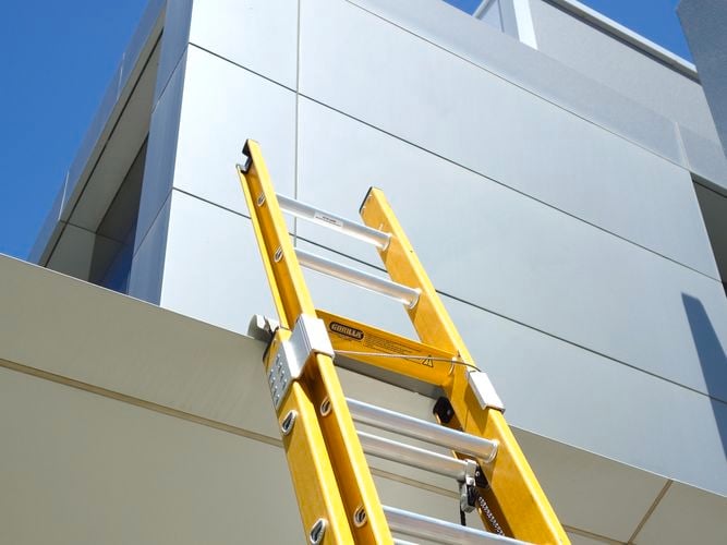 tradesperson working on a ladder