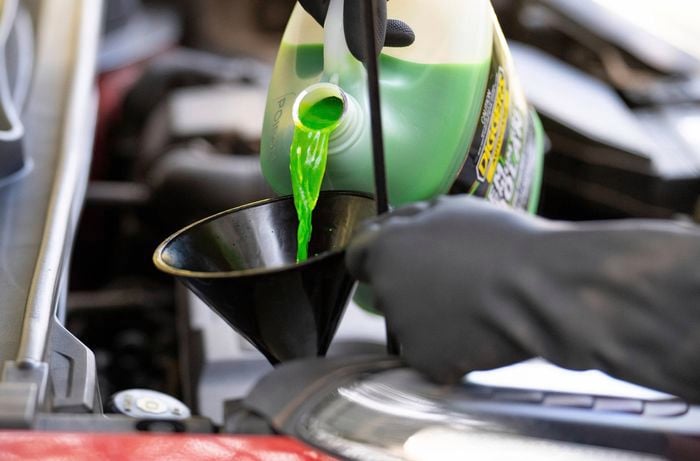 Top up the coolant through a funnel