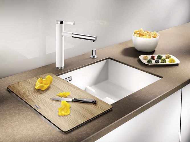 Chips and condiments next to a kitchen sink