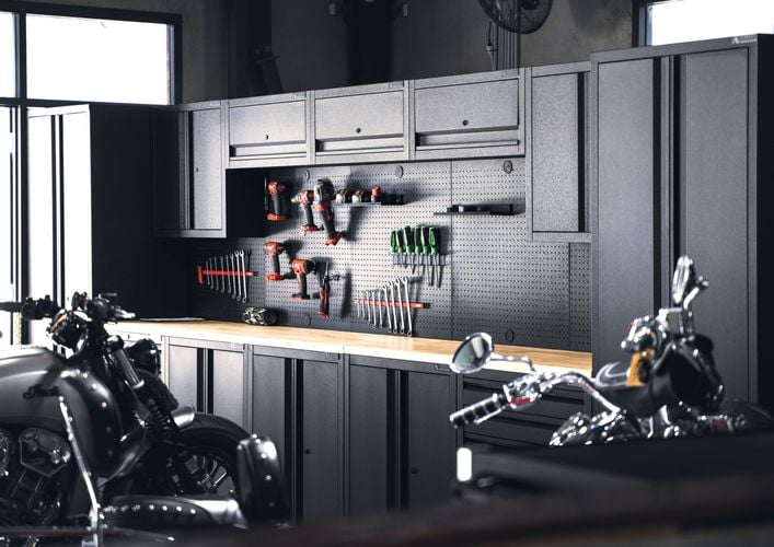 Ironheart Garage featuring the Pinnacle Pro Series Storage Stations and various pegboard hooks.